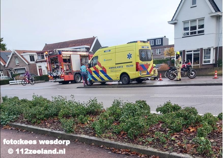 Persoon beknelt tussen fiets